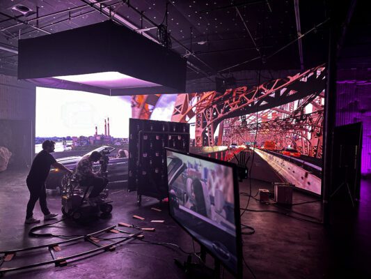 LED wall being used to create realistic reflections for a driving scene